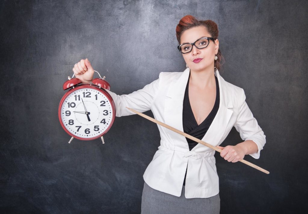 lady holding a clock and pointer