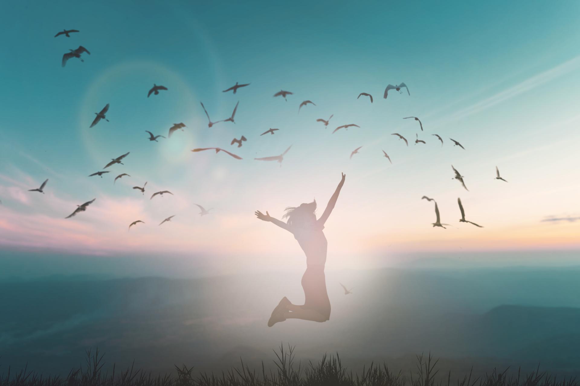 girl jumping to the awakening of her confidence